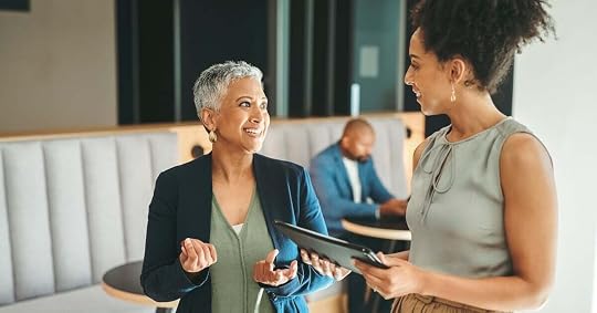 A sales manager holds an impromptu meeting with her subordinate.