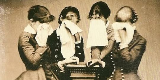 black and white Victorian era photograph of four womne in mourning, all weeping and holding handkerchifs up to the faces