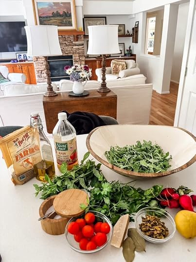 Ingredients for Charlie Bird Salad including pearled farro, apple cider, arugula, basil, mint, pistachios, cherry tomatoes, radishes, and a wedge of Parmigiano Reggiano