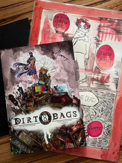 Copy of the DIRTBAGS comic, sitting on a coffeetable on top of one of the original A3 pages.