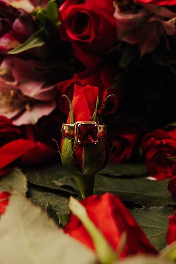 red rose with red diamond ring
