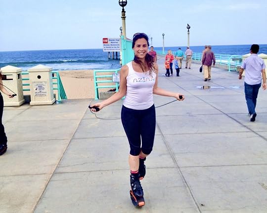 Devin Alexander jumping rope in Kangoo Jumps boots on the Manhattan Beach pier