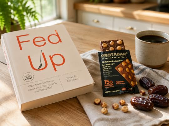 Reading Fed Up by Daniel E. Lieberman with coffee and PROTABAR