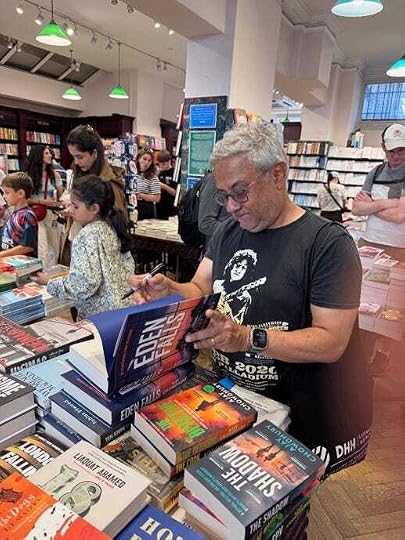 Ajay Chowdhury signing copies of Eden Falls