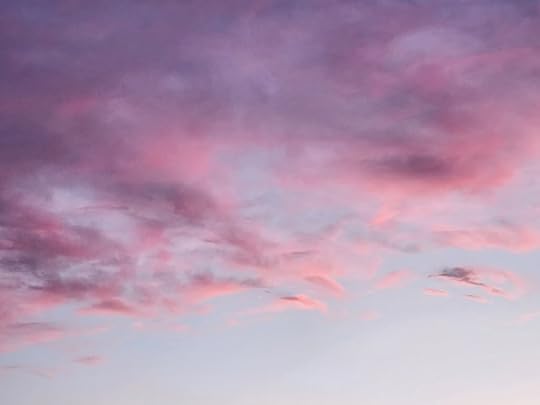A dusk sky with pink and purple clouds.