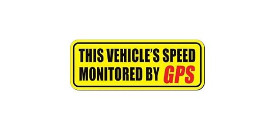 May include: A rectangular yellow sticker with black text that reads: "THIS VEHICLE'S SPEED MONITORED BY GPS." The word "GPS" is in red. The sticker has a black border and is against a white background.