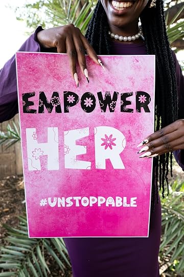Woman holding a sign that says 