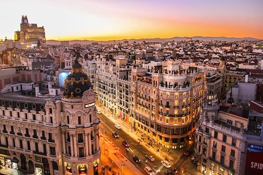 An aerial view of the Metropolis building and Gran Via in Madrid at low sun