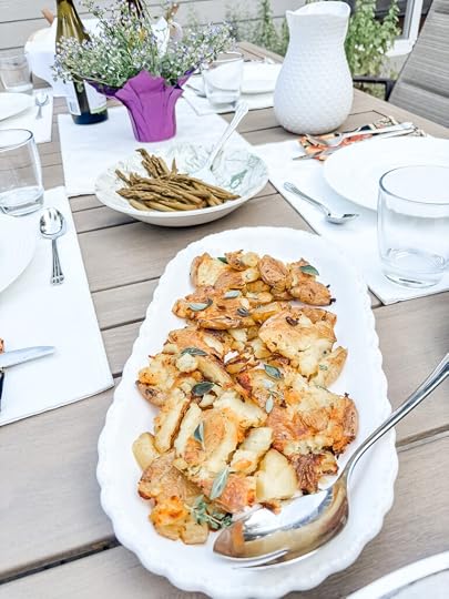 Crispy smashed potatoes with golden brown crunchy edges sprinkled with flaky salt and fresh chopped herbs