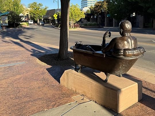Statue of man writing bathtub