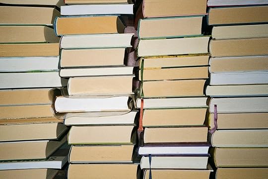 a stack of books sitting on top of each other