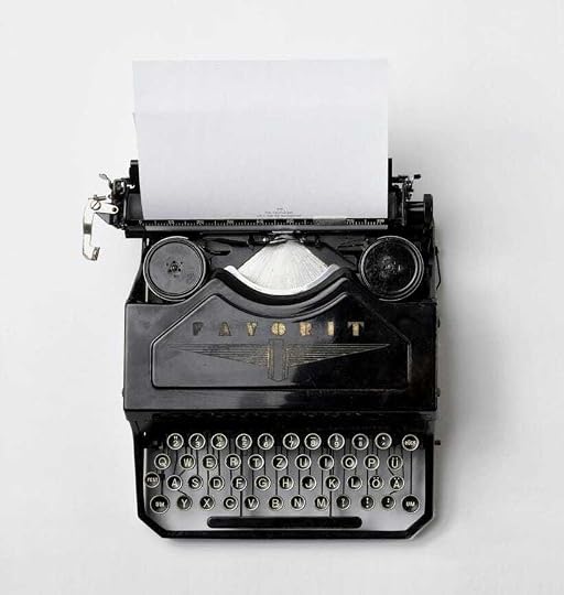 black Fayorit typewriter with printer paper