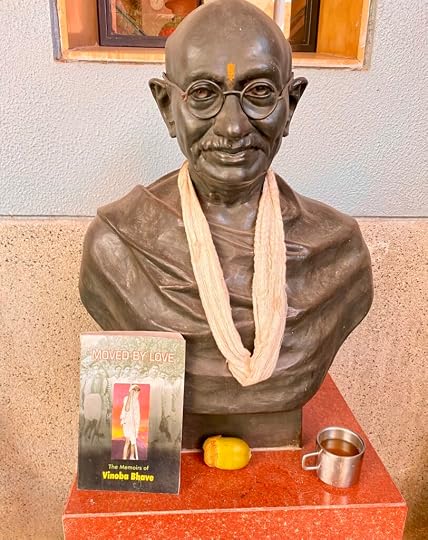 Bust of Mahatma Gandhi at ESI in Ahmedabad, with the book Moved by Love beside it