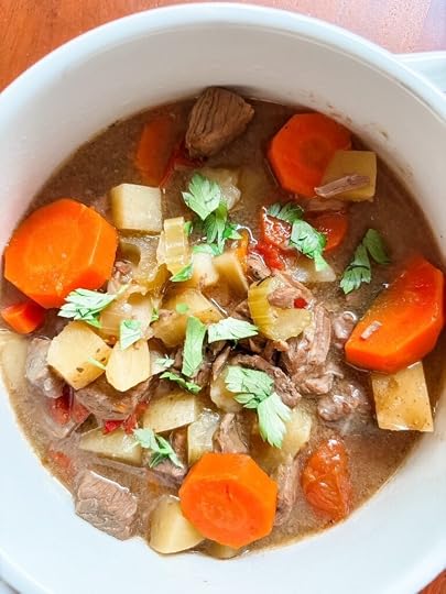Close-up of healthy beef and beer stew showing tender beef and vegetables in a lightly thickened broth