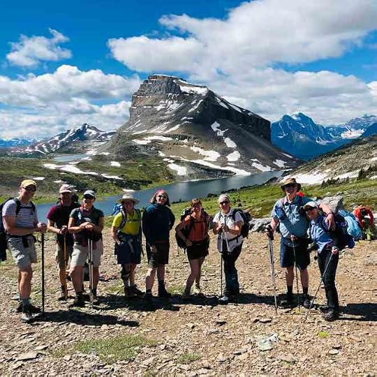 lots of hikers on a mountain pass