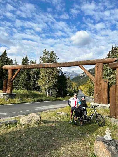 cyclists on the side of the road